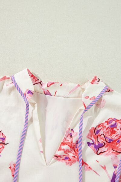 Robe à fleurs imprimée à manches trois-quarts et lien de serrage